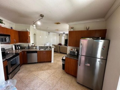 2 bedrooms 2-bathroom apartment. Futures a kitchen with granite on Nicholas Golf Club in Florida - for sale on GolfHomes.com, golf home, golf lot