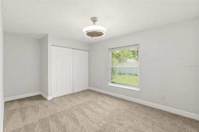 This lovely home is located in the very desirable Cypress Knoll on The Grand Club Cypress Course in Florida - for sale on GolfHomes.com, golf home, golf lot