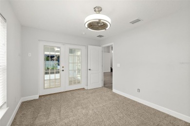 This lovely home is located in the very desirable Cypress Knoll on The Grand Club Cypress Course in Florida - for sale on GolfHomes.com, golf home, golf lot