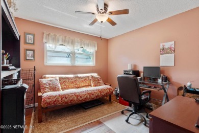 Nestled in a serene setting, this charming home offers a perfect on Blue Cypress Golf Club in Florida - for sale on GolfHomes.com, golf home, golf lot