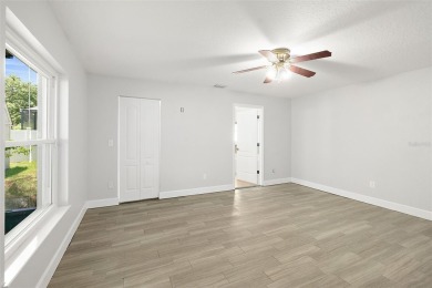 This lovely home is located in the very desirable Cypress Knoll on The Grand Club Cypress Course in Florida - for sale on GolfHomes.com, golf home, golf lot