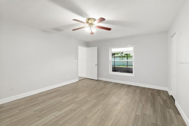This lovely home is located in the very desirable Cypress Knoll on The Grand Club Cypress Course in Florida - for sale on GolfHomes.com, golf home, golf lot