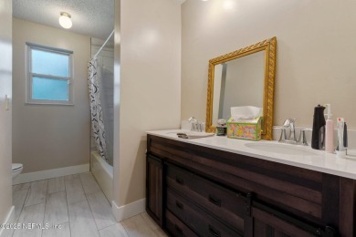 Nestled in a serene setting, this charming home offers a perfect on Blue Cypress Golf Club in Florida - for sale on GolfHomes.com, golf home, golf lot
