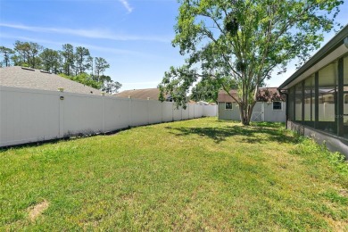This lovely home is located in the very desirable Cypress Knoll on The Grand Club Cypress Course in Florida - for sale on GolfHomes.com, golf home, golf lot