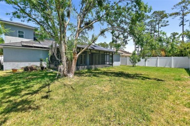 This lovely home is located in the very desirable Cypress Knoll on The Grand Club Cypress Course in Florida - for sale on GolfHomes.com, golf home, golf lot