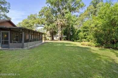 Nestled in a serene setting, this charming home offers a perfect on Blue Cypress Golf Club in Florida - for sale on GolfHomes.com, golf home, golf lot