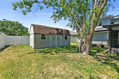 This lovely home is located in the very desirable Cypress Knoll on The Grand Club Cypress Course in Florida - for sale on GolfHomes.com, golf home, golf lot