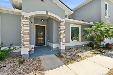 This lovely home is located in the very desirable Cypress Knoll on The Grand Club Cypress Course in Florida - for sale on GolfHomes.com, golf home, golf lot