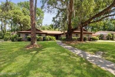 Nestled in a serene setting, this charming home offers a perfect on Blue Cypress Golf Club in Florida - for sale on GolfHomes.com, golf home, golf lot