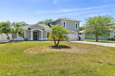 This lovely home is located in the very desirable Cypress Knoll on The Grand Club Cypress Course in Florida - for sale on GolfHomes.com, golf home, golf lot