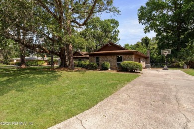 Nestled in a serene setting, this charming home offers a perfect on Blue Cypress Golf Club in Florida - for sale on GolfHomes.com, golf home, golf lot