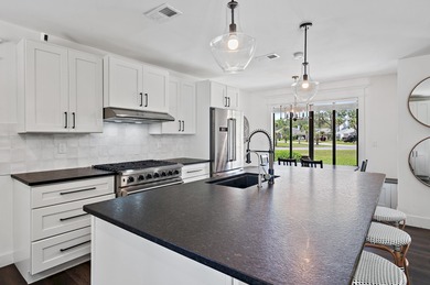 Fully remodeled 4BR/4BA home on nearly 3/4 acre in the desirable on Indian Bayou Golf and Country Club in Florida - for sale on GolfHomes.com, golf home, golf lot