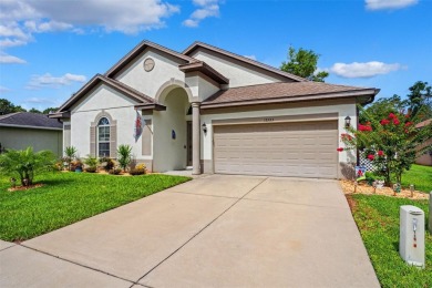 Welcome to 13523 Meadow Golf Ave, a beautifully maintained on Meadow Oaks Golf and Country Club in Florida - for sale on GolfHomes.com, golf home, golf lot