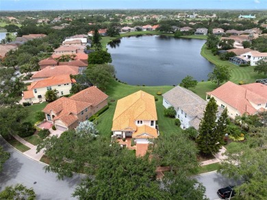 PRICE REDUCED!! LAKEFRONT LUXURY in Prestigious Bayou Club on Bayou Golf Club in Florida - for sale on GolfHomes.com, golf home, golf lot