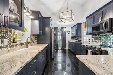 Tucked within the guard-gated community of Hunter's Green on Hunters Green Country Club in Florida - for sale on GolfHomes.com, golf home, golf lot