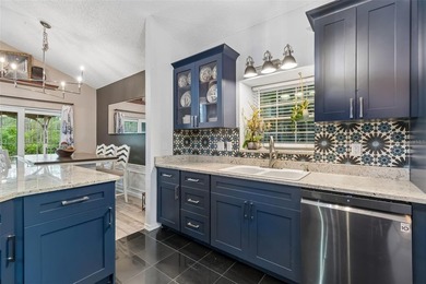 Tucked within the guard-gated community of Hunter's Green on Hunters Green Country Club in Florida - for sale on GolfHomes.com, golf home, golf lot