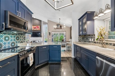 Tucked within the guard-gated community of Hunter's Green on Hunters Green Country Club in Florida - for sale on GolfHomes.com, golf home, golf lot