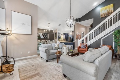 Tucked within the guard-gated community of Hunter's Green on Hunters Green Country Club in Florida - for sale on GolfHomes.com, golf home, golf lot