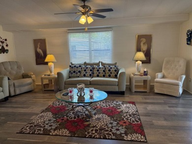 This lovely, manufactured home on leased land.   Priced to sell on Pine Lakes Country Club in Florida - for sale on GolfHomes.com, golf home, golf lot