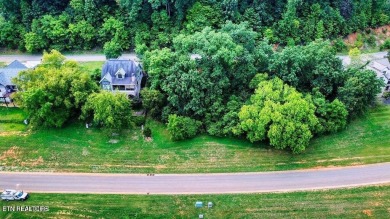 Take advantage of this amazing view and gorgeous sunsets in TN on Tennessee National Golf Club in Tennessee - for sale on GolfHomes.com, golf home, golf lot