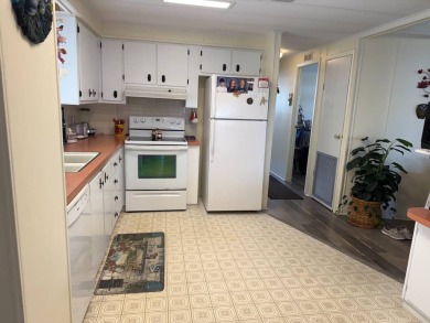 This lovely, manufactured home on leased land.   Priced to sell on Pine Lakes Country Club in Florida - for sale on GolfHomes.com, golf home, golf lot