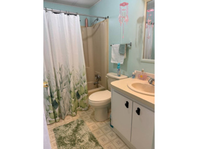 This lovely, manufactured home on leased land.   Priced to sell on Pine Lakes Country Club in Florida - for sale on GolfHomes.com, golf home, golf lot
