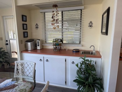 This lovely, manufactured home on leased land.   Priced to sell on Pine Lakes Country Club in Florida - for sale on GolfHomes.com, golf home, golf lot