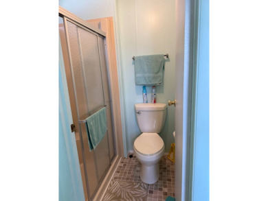This lovely, manufactured home on leased land.   Priced to sell on Pine Lakes Country Club in Florida - for sale on GolfHomes.com, golf home, golf lot