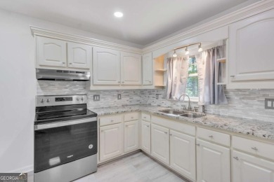 This charming 3-bedroom, 2-bath, 4-sided brick ranch in on Browns Mill Golf Course in Georgia - for sale on GolfHomes.com, golf home, golf lot