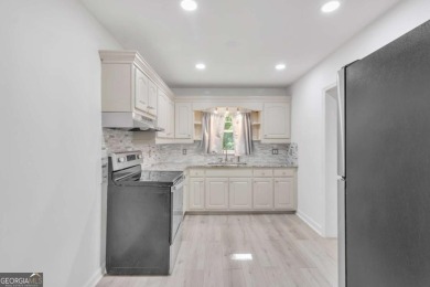 This charming 3-bedroom, 2-bath, 4-sided brick ranch in on Browns Mill Golf Course in Georgia - for sale on GolfHomes.com, golf home, golf lot