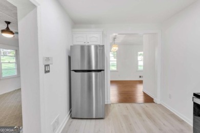 This charming 3-bedroom, 2-bath, 4-sided brick ranch in on Browns Mill Golf Course in Georgia - for sale on GolfHomes.com, golf home, golf lot