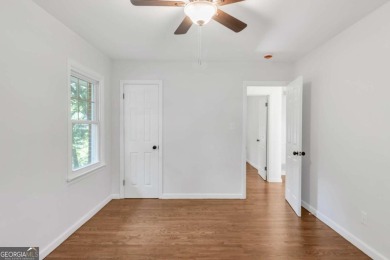 This charming 3-bedroom, 2-bath, 4-sided brick ranch in on Browns Mill Golf Course in Georgia - for sale on GolfHomes.com, golf home, golf lot