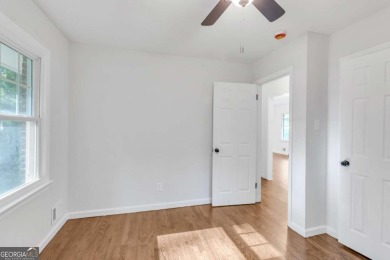 This charming 3-bedroom, 2-bath, 4-sided brick ranch in on Browns Mill Golf Course in Georgia - for sale on GolfHomes.com, golf home, golf lot