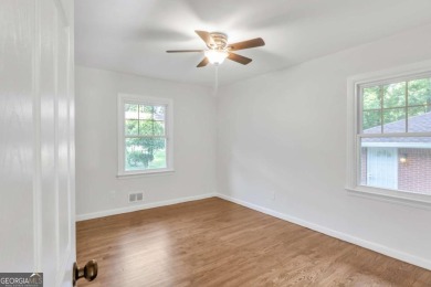 This charming 3-bedroom, 2-bath, 4-sided brick ranch in on Browns Mill Golf Course in Georgia - for sale on GolfHomes.com, golf home, golf lot