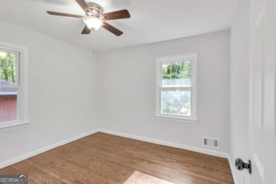 This charming 3-bedroom, 2-bath, 4-sided brick ranch in on Browns Mill Golf Course in Georgia - for sale on GolfHomes.com, golf home, golf lot