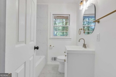 This charming 3-bedroom, 2-bath, 4-sided brick ranch in on Browns Mill Golf Course in Georgia - for sale on GolfHomes.com, golf home, golf lot