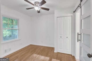 This charming 3-bedroom, 2-bath, 4-sided brick ranch in on Browns Mill Golf Course in Georgia - for sale on GolfHomes.com, golf home, golf lot