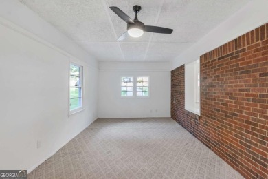This charming 3-bedroom, 2-bath, 4-sided brick ranch in on Browns Mill Golf Course in Georgia - for sale on GolfHomes.com, golf home, golf lot