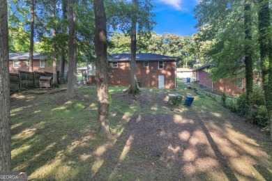 This charming 3-bedroom, 2-bath, 4-sided brick ranch in on Browns Mill Golf Course in Georgia - for sale on GolfHomes.com, golf home, golf lot