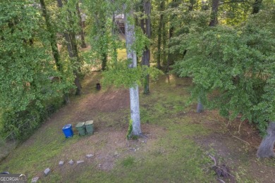 This charming 3-bedroom, 2-bath, 4-sided brick ranch in on Browns Mill Golf Course in Georgia - for sale on GolfHomes.com, golf home, golf lot