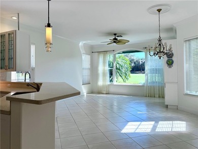 Sunny Oak Harbor Home on 4th fairway w/ an elevated terrace on Oak Harbor Country Club in Florida - for sale on GolfHomes.com, golf home, golf lot