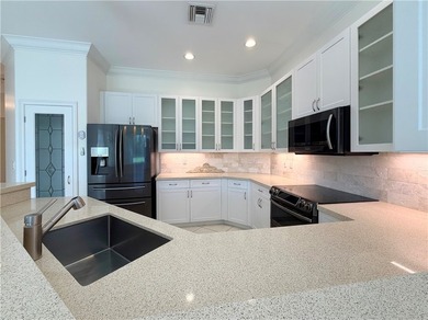 Sunny Oak Harbor Home on 4th fairway w/ an elevated terrace on Oak Harbor Country Club in Florida - for sale on GolfHomes.com, golf home, golf lot