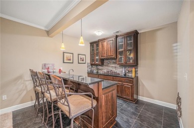 Experience effortless luxury living in this stunning reverse 1 on Staley Farms Golf Club in Missouri - for sale on GolfHomes.com, golf home, golf lot