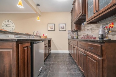 Experience effortless luxury living in this stunning reverse 1 on Staley Farms Golf Club in Missouri - for sale on GolfHomes.com, golf home, golf lot