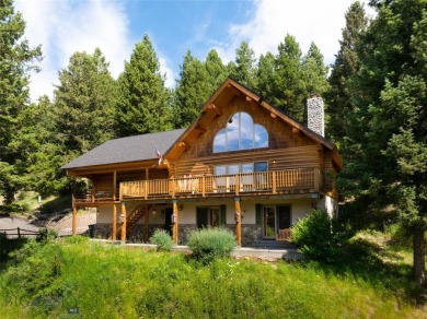 This charming log home, nestled in the trees and perched above on Big Sky of Montana Golf Course in Montana - for sale on GolfHomes.com, golf home, golf lot