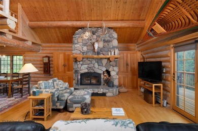 This charming log home, nestled in the trees and perched above on Big Sky of Montana Golf Course in Montana - for sale on GolfHomes.com, golf home, golf lot