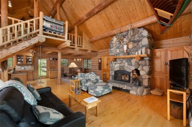 This charming log home, nestled in the trees and perched above on Big Sky of Montana Golf Course in Montana - for sale on GolfHomes.com, golf home, golf lot