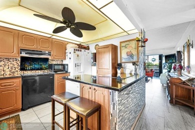 Welcome to this unique 2-bedroom, 2-bathroom corner unit on the on Sunrise Lakes Phase IV Golf Course in Florida - for sale on GolfHomes.com, golf home, golf lot