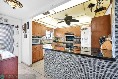 Welcome to this unique 2-bedroom, 2-bathroom corner unit on the on Sunrise Lakes Phase IV Golf Course in Florida - for sale on GolfHomes.com, golf home, golf lot