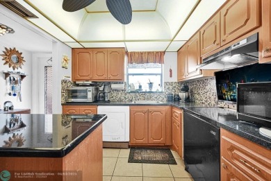 Welcome to this unique 2-bedroom, 2-bathroom corner unit on the on Sunrise Lakes Phase IV Golf Course in Florida - for sale on GolfHomes.com, golf home, golf lot